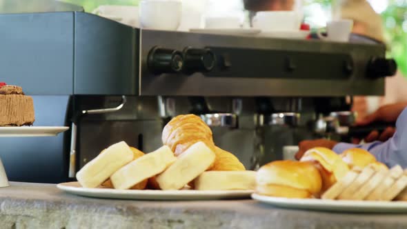 Male owner using coffeemaker alt