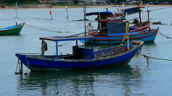 Fishing boats on Ban Kru Chang beach in Phla Ban Chang in Rayong in Thailand alt