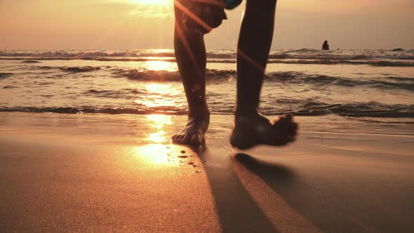 Picturesque Golden Sunbeams Slowly Disappear Behind Horizon As BOY Runs Into the Sea