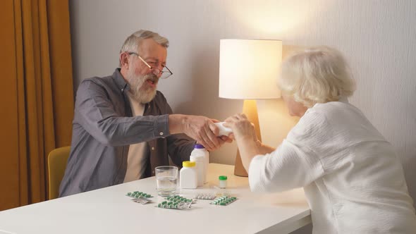Crazy Elderly Couple Merrily Arguing Over a Tube of Medicines