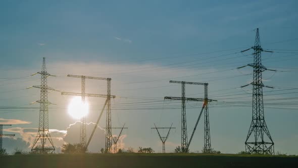 Time Lapse of Sunset With Power Supply Facilities. alt