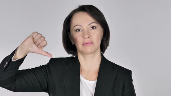 Portrait of Businesswoman Gesturing Thumbs Down alt