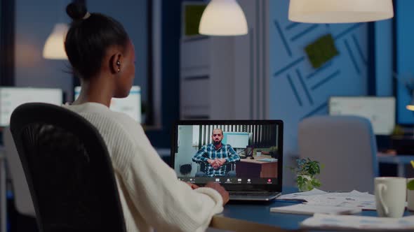 African Businesswoman Having Corporate Meeting with Remotely Paralyzed Man alt