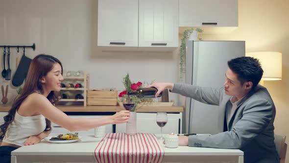 Asian young couple having dinner to celebrate valentine's day together. alt