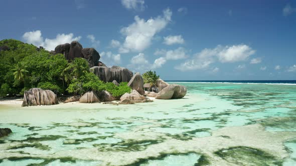 Aerial arc shot around amazing beautiful oasis of granite pink boulder alt