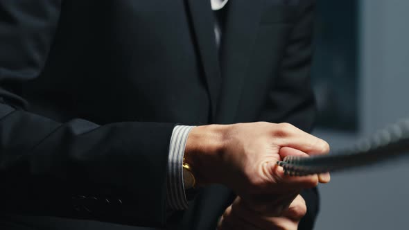 Dressed Man Man Pulls Iron Chain alt
