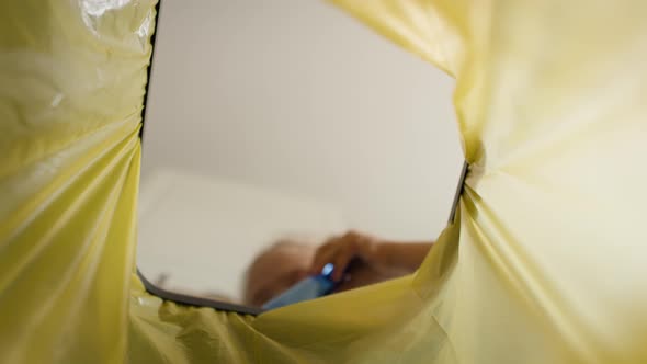 Video of girl throws plastic bottles in the garbage. Shot with RED helium camera in 8K alt