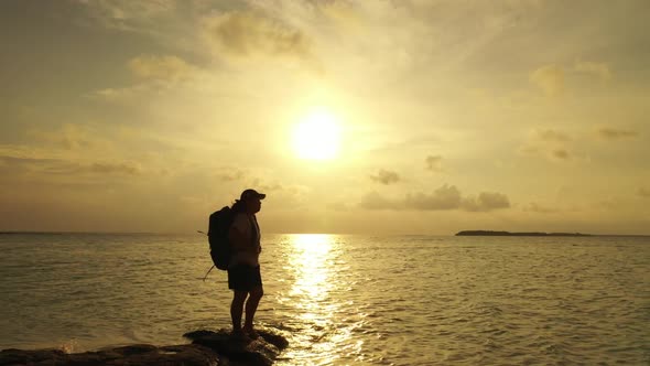 Girl enjoys life on relaxing lagoon beach adventure by blue water and white sandy background of the  alt