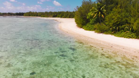 Aerail footage of white sand beach in Muri Lagoon in the Rarotonga in the Cooks island in the southe alt