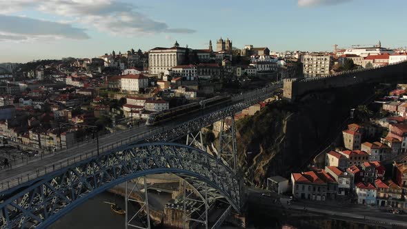 Bridge with Fast Shuttle Tram Against Old Porto Downtown alt