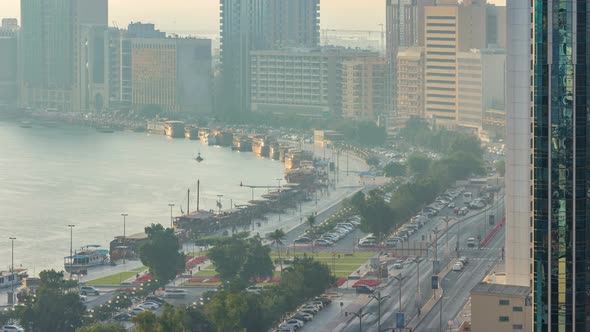 Dubai Creek Landscape Timelapse with Boats and Ship in Port and Modern Buildings in the Background alt
