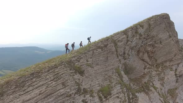 Group of four friends hiking in Umbria, Italy