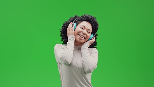 Green Screen Young Joyful African Female Enjoy Music