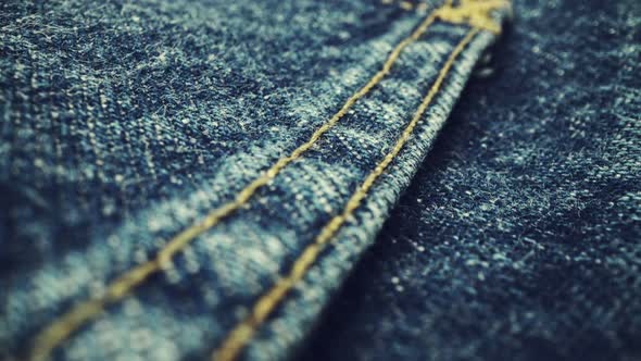 Extreme Detailed of Blue Denim Jeans Texture in Dolly Shot Over Cloth Surface alt