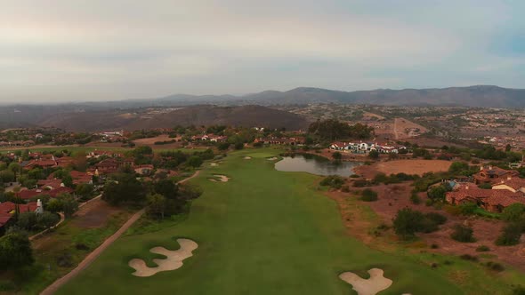 Millionaires luxurious mansions with a golf course seen from above alt