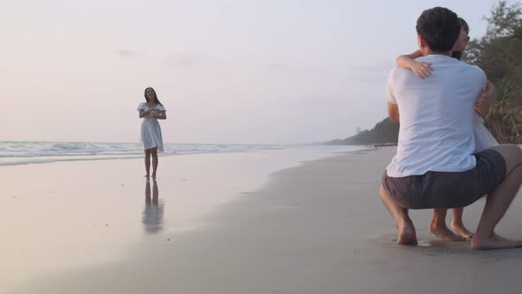 Asian Family playing together at beach with kids happy vacation travel beach concept alt