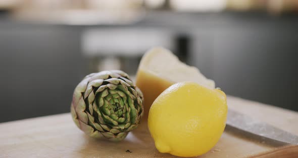 View of a lemon an artichoke and cheese alt