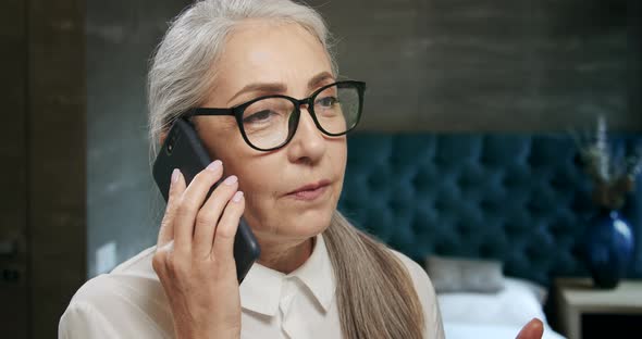 Elderly Woman Talking on Smartphone