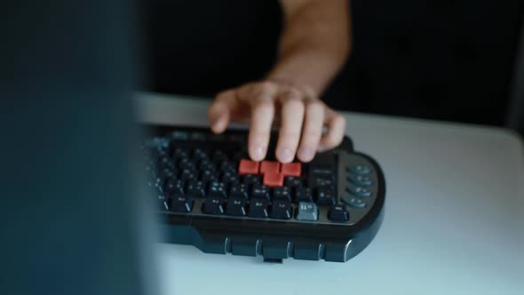 Man Play Video Game Using Keyboard alt