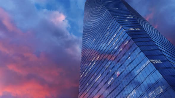 Modern Glass Skyscraper Against The Sky At Sunset
