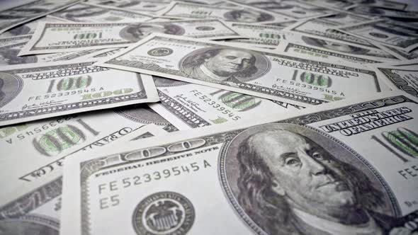 American One Hundred Dollar Paper Banknote Pile on Office Desk alt