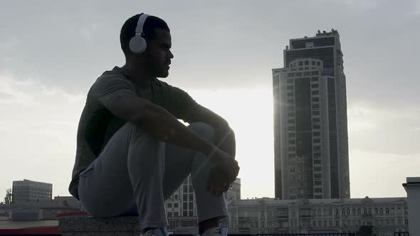 Thoughtful Man Wondering About Personal Struggles on Metropolis Background alt