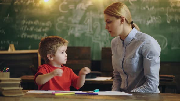 Elementary School. Teacher and Child Having Fun on Learning in an Preschool. alt