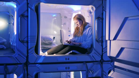 Capsule Room with a Young Woman in It alt