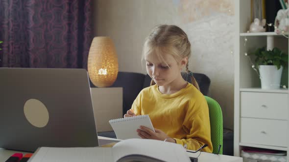 Child Learns Online Using Laptop