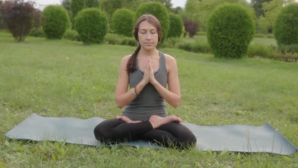 Front View of a Woman Instructor Seated Yoga Asana Lotus Pose Lotus Posture Padmasana