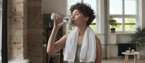 Cheerful Woman Posing for Camera after Yoga PRactice alt