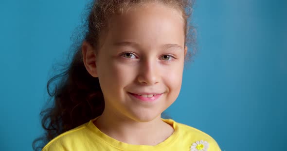 Portrait of a Happy Child Smiling a Little Girl Looking at the Camera Smiling a Portrait of a Child alt