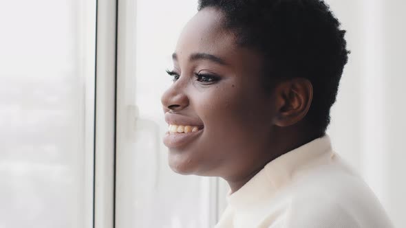 Portrait of Afro American Girl Ethnic Black Woman Female Profile Looking Out Window Standing in alt