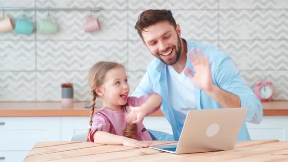 Young family with a child talking using a microphone and webcam alt