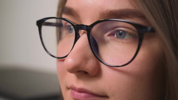 Closeup of Woman Face in Glasses Woman Has Beautiful Blue Eyes alt