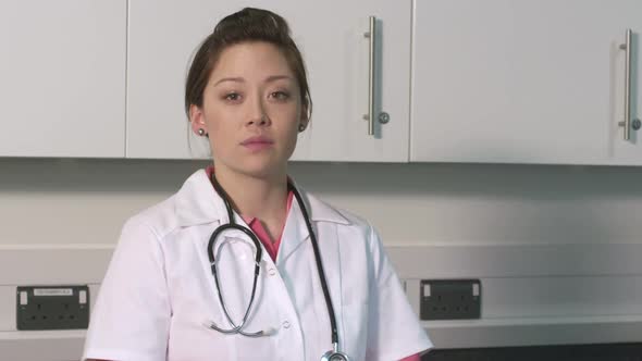 CU Female doctor standing with arms crossed in hospital / London, Greater London, United Kingdom