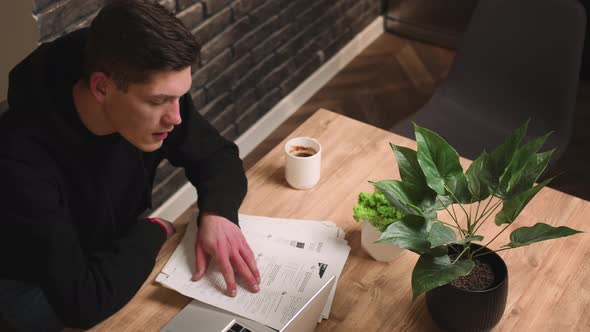 Serious Young Businessman Has Conference Video Calling By Webcam Working with Papers Focused Student alt