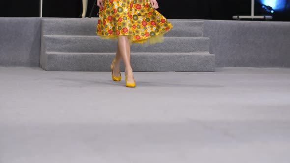 Yellow Pumps Sandals on Feet of Woman Model That Walks on Catwalk Defile Podium