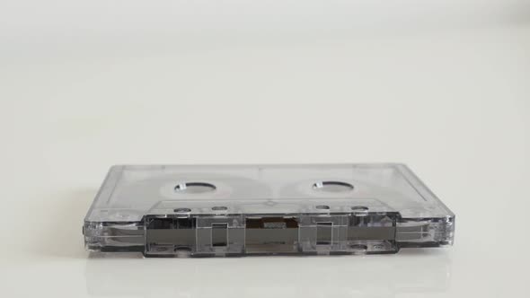 Transparent analog magnetic tape close-up 4K 2160p 30fps UltraHD tilting footage - Retro compact  au