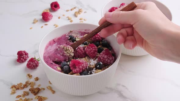 Berry Smoothie Bowl with Granola Coconut and Hemp Seeds Marble Background alt