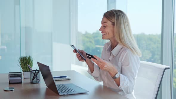 Smiling Beautiful Lady Customer Shopper Making Online Purchase on Smart Phone alt