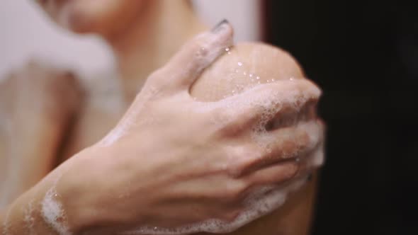 Beautiful Young Redhaired Woman Bathes in the Shower Washes Her Hair and Her Body alt