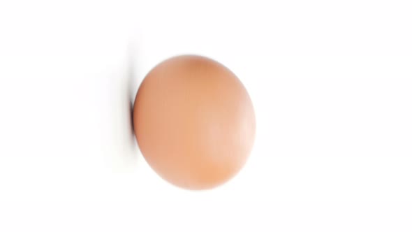 Vertical video, Egg are rolling isolated on white background