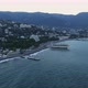 Aerial View of The City on The Coastline of The Sea Against the Mountains - VideoHive Item for Sale
