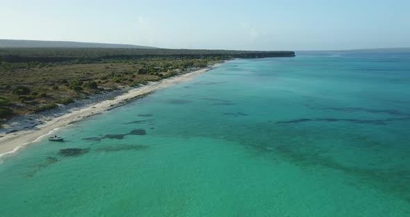 Low-altitude drone flight in the jaragua national park, highlighting the crystal clear water on a be alt