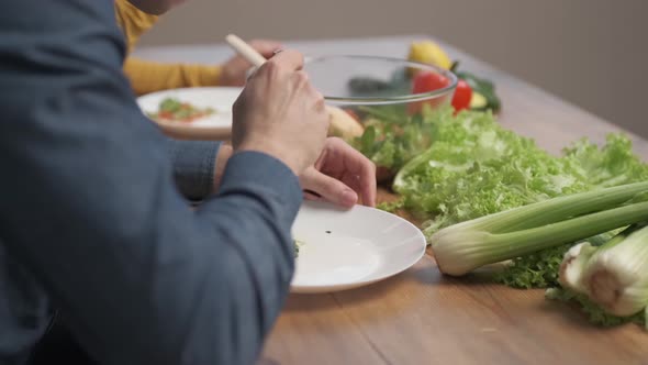 A man eating a vegetarian salad of fresh vegetables. Sports Nutrition and Healthy Eating alt