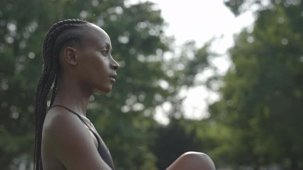 Woman with Afro Braids Having Outdoors Workout alt