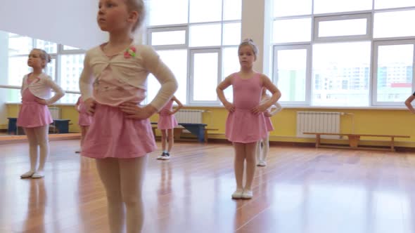 Group of little girls practicing in ballet school