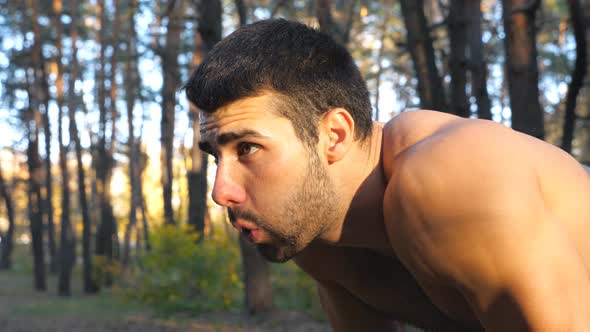 Profile of Tired Runner Taking Break After Hard Run Training in Forest alt