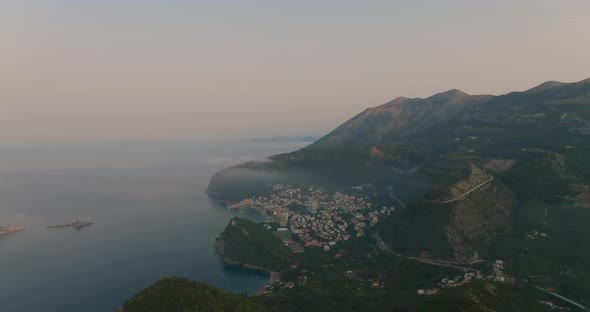 aerial view on Petrovac, Budva with clouds on sunrise alt